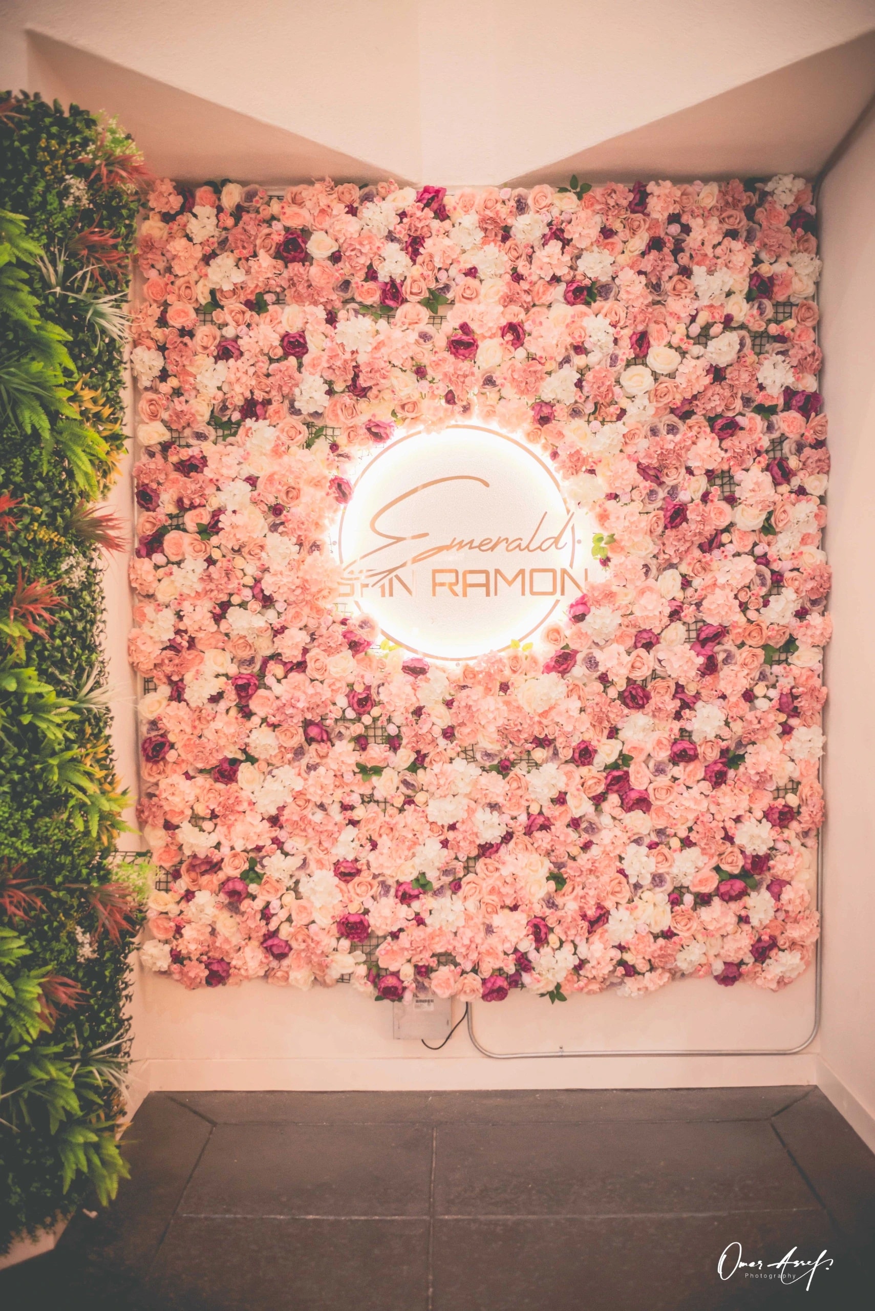 Flowers on a table with the hall behind